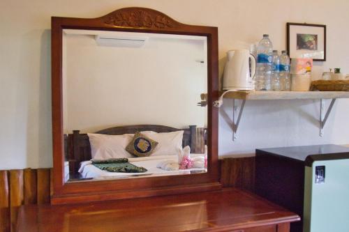 En eller flere senge i et værelse på Lanta White Rock Resort