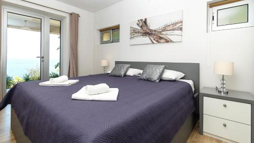 En eller flere senge i et værelse på Villa Julia - Korcula by Villas Guide