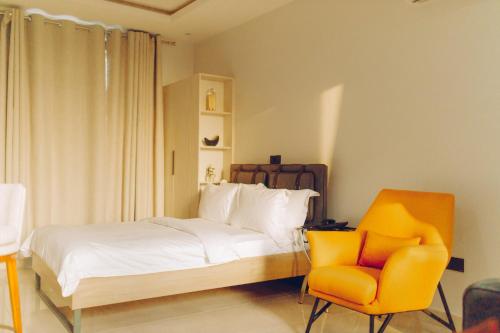 Postel nebo postele na pokoji v ubytování Elysium Suites & Apartments