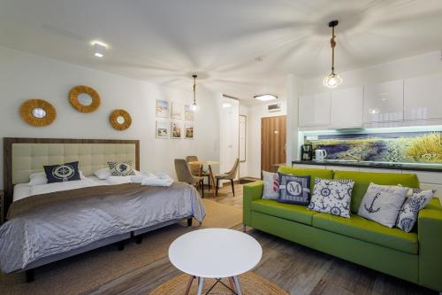 En eller flere senge i et værelse på Apartamenty Baltic Horst Basen & Restauracja