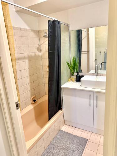 a bathroom with a tub and a sink and a shower at Affordable accommodation near Perth CBD in Perth