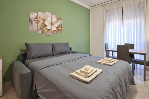 En eller flere senge i et værelse på Davide Host Casa Pirandello 3 min Metro