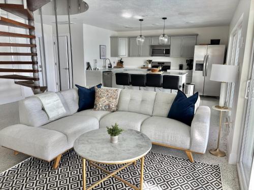 a living room with a couch and a table at Bayside Grande Villa in Clearwater Beach