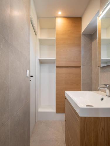 a bathroom with a sink and a mirror at Marrakech - Gare - CEA - STMicro in Fontaine