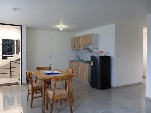 Køkken eller tekøkken på ApartaHotel HyL Simijaca