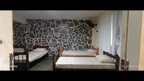 En eller flere senge i et værelse på Pousada Cantinho e Sossego casa 5