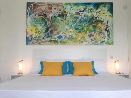 Giường trong phòng chung tại La Oursha Apartment