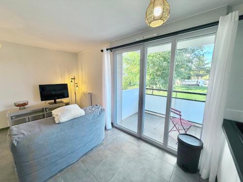 En eller flere senge i et værelse på T2 Paisible et Confort - Colomiers Centre