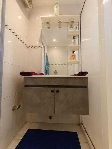 a bathroom with a sink and a mirror at Villa Hay Riad - Harhoura in Temara