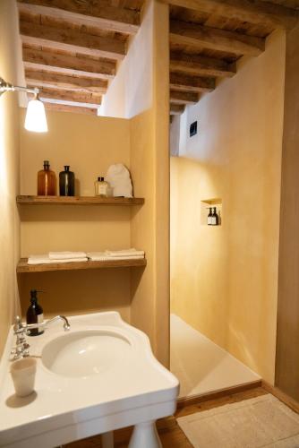 a bathroom with a sink and a shower at Eikenbrand in Veurne