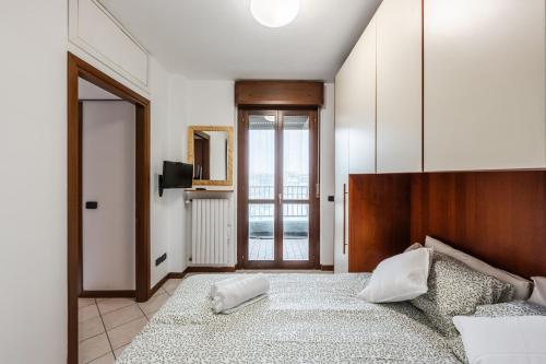 Postel nebo postele na pokoji v ubytování Curiel 194, SmartStay - Appartamento - Ospedale Humanitas, Fiordaliso, Forum Assago