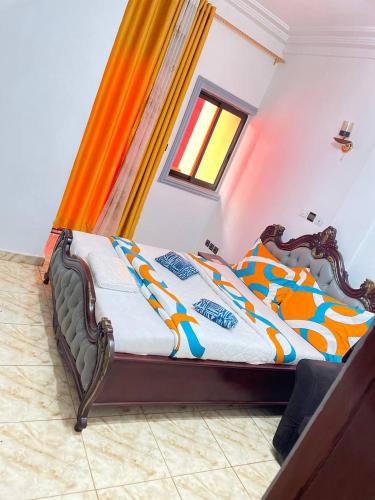 Ένα ή περισσότερα κρεβάτια σε δωμάτιο στο NGK Hôtel Apartment