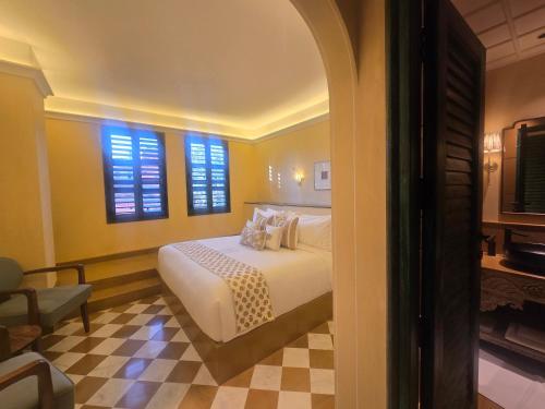 Postel nebo postele na pokoji v ubytování Abode Jaipur