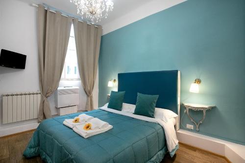 Postel nebo postele na pokoji v ubytování Residenza Centro Storico