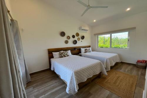 Postel nebo postele na pokoji v ubytování Triskele Retreat - Combo Ocean and Earth