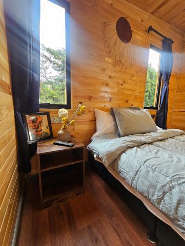 Postel nebo postele na pokoji v ubytování Cabaña Entre montañas La Calera