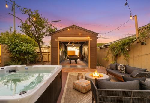a backyard with a jacuzzi tub in a yard at Balboa 6BR Mansion with Hot Tub and Game Room in San Diego