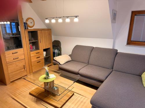 a living room with a couch and a table at Kuckucksnest in Ühlingen-Birkendorf