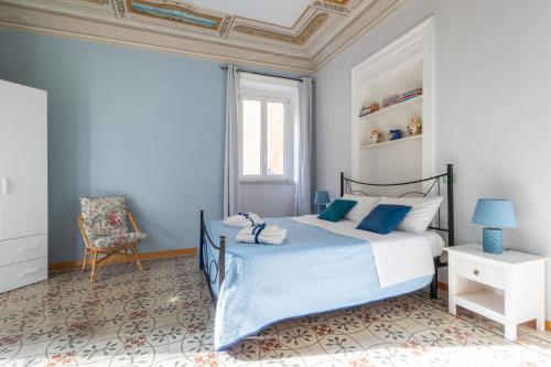 En eller flere senge i et værelse på Apt City Center Meraviglie Di Sicilia