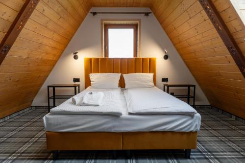 En eller flere senge i et værelse på Zapotoczny Residence