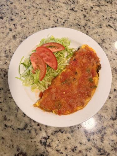a plate with a piece at Hotel Nieto Express in Matamoros