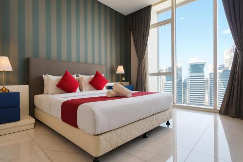 a bedroom with a large bed and a large window at The Platinum Kuala Lumpur by MAHA in Kuala Lumpur