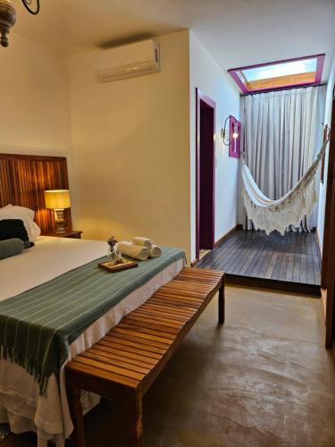 En eller flere senge i et værelse på Pousada Berço Mineiro