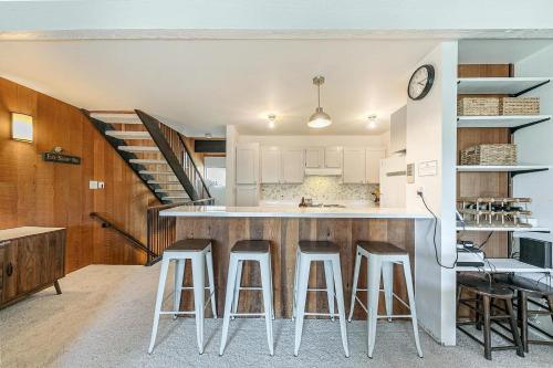 a kitchen with a counter and some stools at Kingswood Pines in Kings Beach