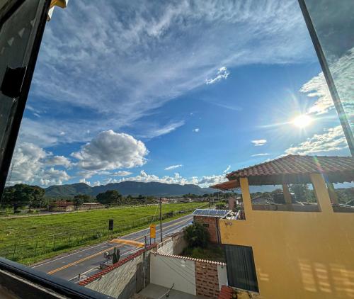 a view from a bus window of a road at Hotel WM in Teresina de Goias