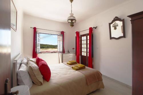 En eller flere senge i et værelse på Casa Morais