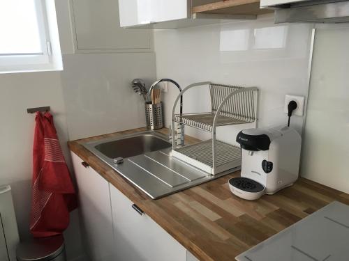 Kuchyň nebo kuchyňský kout v ubytování Le Dix-Huit Studio Duplex