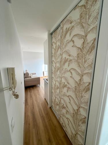 a hallway with a wall with a patterned wall at Hello sunshine nice in Nice