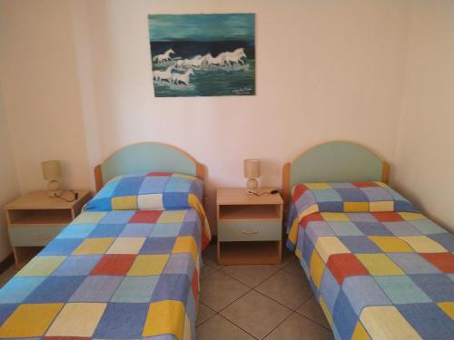 Een bed of bedden in een kamer bij Lungomare 2