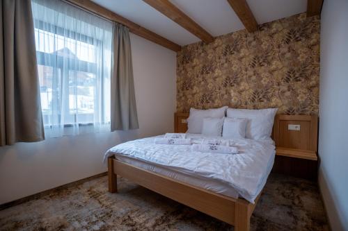 Postel nebo postele na pokoji v ubytování Apartmány Lúčny Raj