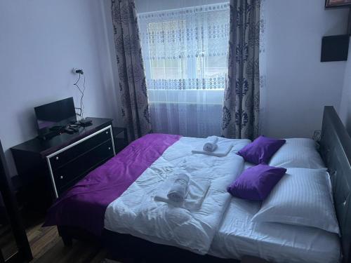 Un ou plusieurs lits dans un hébergement de l'établissement Cabana Bianca & Iair