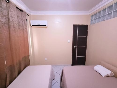 Postel nebo postele na pokoji v ubytování Apto inteiro 3 quartos, sendo duas suítes