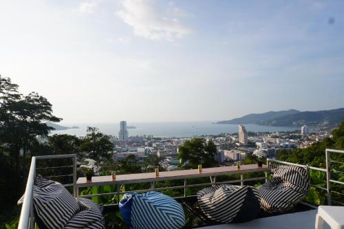 a group of umbrellas sitting on top of a balcony at Residy Retreat x Baan Suan Villa in Patong Beach