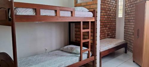 En eller flere senge i et værelse på Chalé Condomínio Porto dos Lençóis