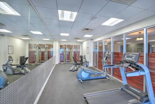a gym with several treadmills and elliptical machines at Daytona Beach Resort Condos in Daytona Beach