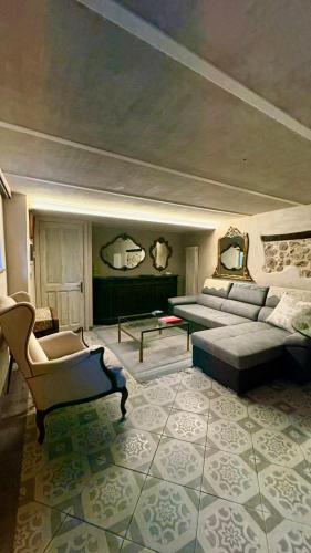 a living room with a couch and a table at La Casa di Paolo in Battifollo