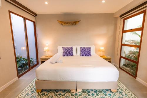 En eller flere senge i et værelse på Hotel Libreria Cafe de Pombal