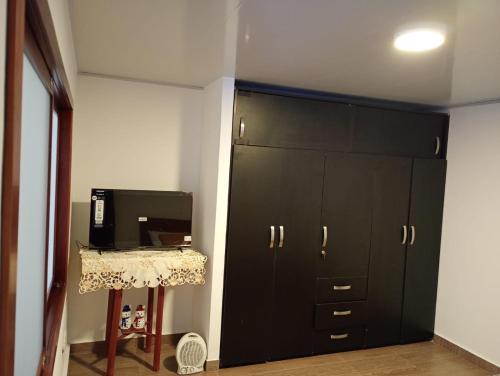 Et tv og/eller underholdning på Apartamento céntrico cerca a todo