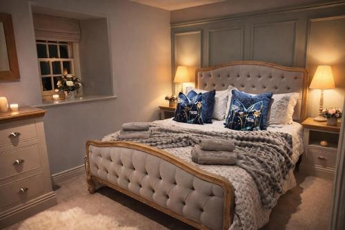 En eller flere senge i et værelse på Kingfisher Cottage at Aysgarth Falls