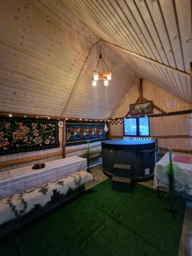 a large room with a tub in a tent at Casa Roxana in Vişeu de Mijloc