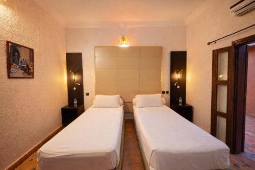 Ένα ή περισσότερα κρεβάτια σε δωμάτιο στο Gite Souss