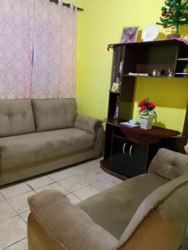 Posezení v ubytování Casa simples e aconchegante em Cunha