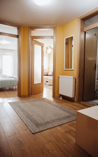 a living room with yellow walls and a rug at Ice Queen Vlasic in Šišava