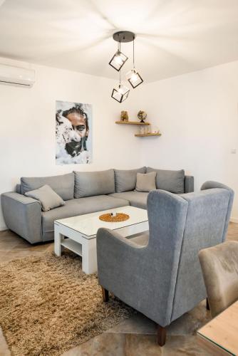 a living room with a couch and a coffee table at Apartment MATEJA in Tivat