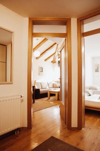 a hallway with a living room with a bed and a living room at Ice Queen Vlasic in Šišava