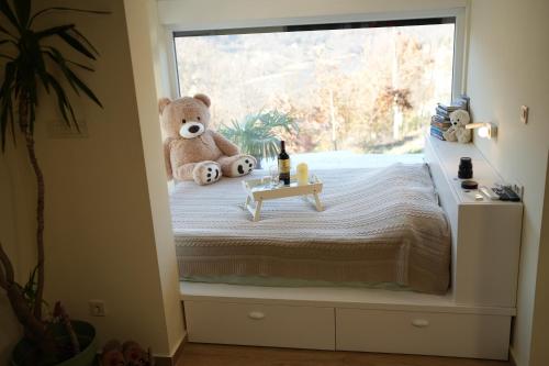 En eller flere senge i et værelse på Vila Horizont